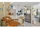 Bright kitchen with stainless steel fridge, breakfast bar, and white cabinetry at 21103 Patio View Ct # 3305, Lutz, FL 33558