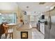 Kitchen with stainless appliances, white cabinetry, and natural light at 21103 Patio View Ct # 3305, Lutz, FL 33558