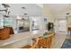 Open kitchen featuring stainless steel appliances, breakfast bar, and views to living area at 21103 Patio View Ct # 3305, Lutz, FL 33558