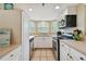 Bright kitchen with stainless appliances, ample cabinet space, and bay window at 21103 Patio View Ct # 3305, Lutz, FL 33558
