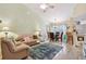 Bright living room featuring a vaulted ceiling, modern decor, and dining area at 21103 Patio View Ct # 3305, Lutz, FL 33558