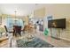 Open-concept living space with dining area, breakfast bar, and views to the kitchen at 21103 Patio View Ct # 3305, Lutz, FL 33558