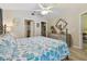 Inviting bedroom featuring a queen bed, ceiling fan, and ample closet space for organized living at 21103 Patio View Ct # 3305, Lutz, FL 33558