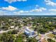 Stunning aerial view of modern townhomes nestled among lush greenery under a vibrant blue sky at 2205 16Th N St, St Petersburg, FL 33704
