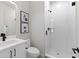Contemporary bathroom featuring a glass shower and modern vanity with black hardware at 2205 16Th N St, St Petersburg, FL 33704