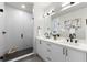 This bathroom features double sinks with sleek, modern black hardware and a spacious glass-enclosed shower at 2205 16Th N St, St Petersburg, FL 33704