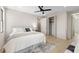 Bright bedroom features neutral tones, a ceiling fan, a comfortable bed, and a spacious closet at 2205 16Th N St, St Petersburg, FL 33704