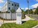 Elegant community sign at Woodlawn neighborhood featuring lush landscaping at 2205 16Th N St, St Petersburg, FL 33704