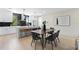 Open-concept dining area with table, chairs, and an adjacent kitchen island at 2205 16Th N St, St Petersburg, FL 33704