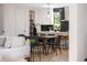 Dining room features a table with seating adjacent to an open kitchen and a large window at 2205 16Th N St, St Petersburg, FL 33704