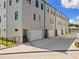 A modern residential building featuring garages, creating street appeal and offering convenient parking at 2205 16Th N St, St Petersburg, FL 33704