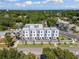 Modern townhome exterior with neutral colors, meticulous landscaping, and inviting curb appeal at 2205 16Th N St, St Petersburg, FL 33704