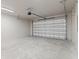 Spacious two-car garage with concrete floors and an automatic door opener at 2205 16Th N St, St Petersburg, FL 33704