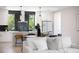 Well-lit kitchen with a breakfast bar and an adjacent dining and living area at 2205 16Th N St, St Petersburg, FL 33704