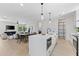 Open-concept kitchen with island, dining area, and living room, perfect for modern living at 2205 16Th N St, St Petersburg, FL 33704