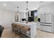 Bright kitchen featuring a large quartz island, sleek cabinetry, and contemporary pendant lighting at 2205 16Th N St, St Petersburg, FL 33704