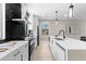 Bright kitchen with white countertops, sleek appliances, and black backsplash at 2205 16Th N St, St Petersburg, FL 33704