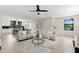 Open-concept living area with modern furnishings, kitchen with breakfast bar, and bright natural light at 2205 16Th N St, St Petersburg, FL 33704
