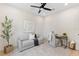 Cozy home office with a sofa, desk, modern art, hardwood floors, and natural light at 2205 16Th N St, St Petersburg, FL 33704