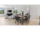 Bright, open floorplan featuring a spacious dining area adjacent to a comfortably furnished living room at 2205 16Th N St, St Petersburg, FL 33704