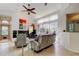 Bright living room with a fireplace, modern art, and a view of the pool area at 2217 Windsong Ct, Safety Harbor, FL 34695