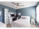 Comfortable bedroom with desk and decorative shelving, perfect for relaxation or work at 2334 Audubon Preserve Ln, Lutz, FL 33558