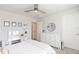 Well-lit bedroom featuring a ceiling fan, window and a comfortable bed at 2334 Audubon Preserve Ln, Lutz, FL 33558