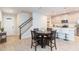 Inviting dining area and kitchen featuring modern appliances and stylish countertops at 2334 Audubon Preserve Ln, Lutz, FL 33558