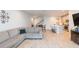 Inviting living area featuring an open layout with dining area, stairs and cozy sectional sofa at 2334 Audubon Preserve Ln, Lutz, FL 33558