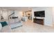 Open-concept living space flows seamlessly into the kitchen with barstool seating, ideal for modern living at 2334 Audubon Preserve Ln, Lutz, FL 33558