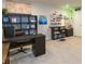 Spacious room with a large desk, custom shelving, and plenty of natural light for a productive work environment at 2334 Audubon Preserve Ln, Lutz, FL 33558