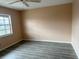 Neutral bedroom featuring wood-look floors, natural light and fresh paint at 24862 Us Highway 19 N # 1504, Clearwater, FL 33763