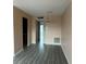 Open concept room offering a spacious area with modern flooring and an elegant chandelier at 24862 Us Highway 19 N # 1504, Clearwater, FL 33763