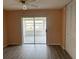 Bright room featuring fresh paint, wood-look floors and a sliding door to a screened patio at 24862 Us Highway 19 N # 1504, Clearwater, FL 33763