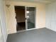 View of a screened porch with sliding glass doors leading to the interior at 24862 Us Highway 19 N # 1504, Clearwater, FL 33763