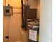 Utility closet featuring new water heater, shelving, and electrical panel at 24862 Us Highway 19 N # 1504, Clearwater, FL 33763