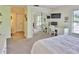 Primary bedroom featuring a desk and a mirrored closet at 2985 W Knights Ave # 2985, Tampa, FL 33611