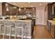 Updated kitchen featuring granite countertops, stainless steel appliances, and a convenient breakfast bar at 2985 W Knights Ave # 2985, Tampa, FL 33611