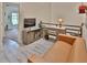 Loft area featuring desk, sofa, TV, and a view into another room at 2985 W Knights Ave # 2985, Tampa, FL 33611