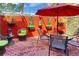 Charming patio with brick pavers, colorful walls, outdoor seating, and a translucent roof for ample natural light at 2985 W Knights Ave # 2985, Tampa, FL 33611