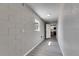 Hallway with light-grey luxury vinyl plank flooring and painted cinder block walls at 3213 King William Cir, Seffner, FL 33584