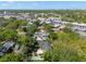 The property is situated near a vibrant street in an established neighborhood with lush tree canopy and greenery at 3412 W Mckay Ave, Tampa, FL 33609
