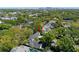 Aerial view showing the home's location amongst lush greenery and neighborhood amenities at 3412 W Mckay Ave, Tampa, FL 33609