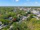 Aerial view shows the property situated amidst lush greenery and residential neighborhood at 3412 W Mckay Ave, Tampa, FL 33609