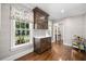 Bar area with custom cabinetry, marble countertop, and view to backyard at 3412 W Mckay Ave, Tampa, FL 33609