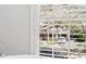 The bathroom features a soaking tub with a view out of the bright shuttered window at 3412 W Mckay Ave, Tampa, FL 33609