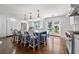 Modern kitchen featuring stainless appliances, an island with seating, and sliding doors at 3412 W Mckay Ave, Tampa, FL 33609