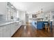 Bright kitchen with a marble backsplash, stainless steel appliances, and a large center island at 3412 W Mckay Ave, Tampa, FL 33609