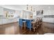Spacious kitchen with white cabinets, contrasting island, marble counters, and pendant lighting at 3412 W Mckay Ave, Tampa, FL 33609