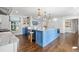 Open-concept kitchen featuring an oversized center island and stainless steel appliances at 3412 W Mckay Ave, Tampa, FL 33609